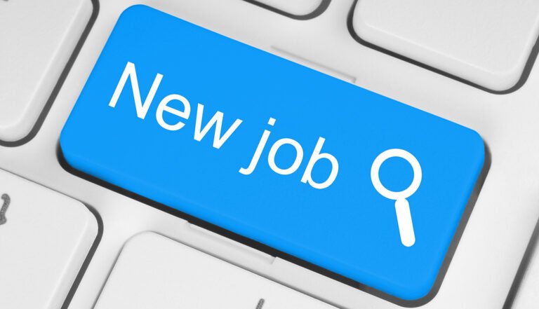 Blue new job button on white keyboard